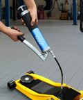8000 PSI Heavy Duty Lever Action Grease Gun Kit With 14oz Aluminum Barrel in use on floor jack