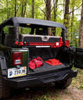 Heavy Duty Rubber Shovel Mount Clamp Fits One And One Eighth To One And One Half Inch Objects Holds Up To Twenty Six Lbs Per Clamp installed on SUV