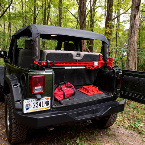 Heavy Duty Rubber Shovel Mount Clamp Fits One And One Eighth To One And One Half Inch Objects Holds Up To Twenty Six Lbs Per Clamp installed on SUV
