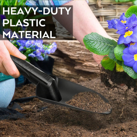 Heavy Duty Black Sand Scoop And Shovel digging soil beside flowers, highlighting its weather resistant and rustproof properties.