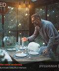 Man setting dinner table under LED B10 Light Bulbs 300 Lumens 2700K Soft White Non Dimmable 4.5W Clear Glass in cozy interior