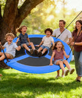 Family enjoying 60 Inch Large Saucer Tree Swing For Kids And Adults With 700 Pound Capacity in backyard with kids swinging