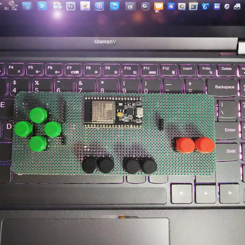 DIY electronics setup with green and red tactile push buttons on a breadboard, part of 50 Pcs Tactile Push Button Kit For Breadboard Projects