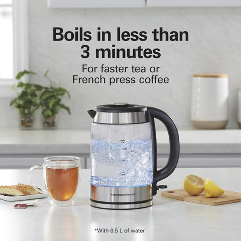 Electric Tea Kettle With 1500 Watts For Fast Boil 1.8 Liter Water Boiler Cordless Serving Auto Shutoff on countertop with tea and lemon