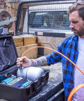 Heavy Duty Road Trip Ready 12 Volt Twin Motor Portable Air Compressor With Integrated Aluminum Tank and Quick Pressure Adjustments for off road use.