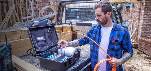 Heavy Duty Road Trip Ready 12 Volt Twin Motor Portable Air Compressor With Integrated Aluminum Tank and Quick Pressure Adjustments for off road use.
