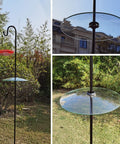 Large 13 Inch Glass Rain Cover For Outdoor Bird Feeder, Two Way Hanging Or Shepherd Pole Mount, Weatherproof Clear Dome Shield, 33 Cm Diameter To Protect Feeder From Rain Snow Debris shown on a shepherd pole in a garden.