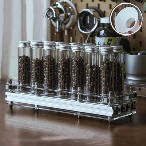 14 Piece Single Dose Coffee Bean Storage Tubes With Airtight One Way Valve And Heavy Duty Metal Stand holding fresh coffee beans.