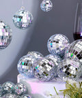 Assorted sizes of silver mirror disco balls from the 65 Pcs Mirror Disco Balls Set for Hanging Decor in Assorted Sizes 3cm 5cm 6cm 8cm Silver Party Ornaments