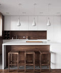 Modern kitchen with built-in appliances in white and brown tones, featuring 24 Inch Wide Built In Automatic Coffee Machine With Home Connect.
