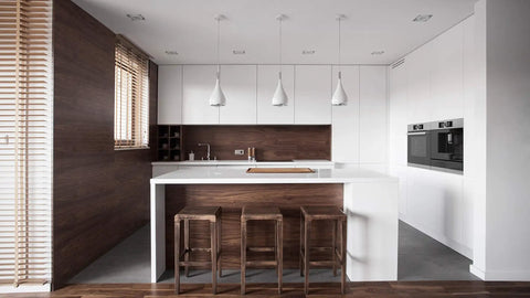 Modern kitchen with built-in appliances in white and brown tones, featuring 24 Inch Wide Built In Automatic Coffee Machine With Home Connect.