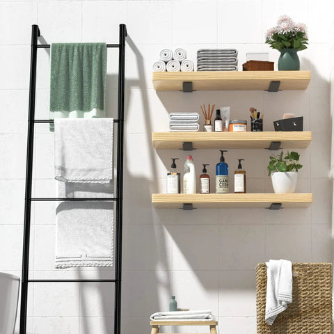 Floating shelves with Set Of 6 8 Inch Heavy Duty Hidden L Shelf Brackets For Floating Shelves Supports Up To 200 Pounds With Rustic Industrial Black Iron Finish Durable Steel Construction For Easy Mounting And Modern Home Or Workshop Use, holding towels and toiletries in a bathroom setting.