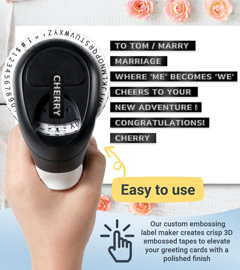 Retro Manual Embossing Label Maker With 9mm Tapes in hand, showing black embossed labels for scrapbooking and DIY crafts.