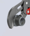 Close-up of the jaw of Rapid Adjust Swedish Pipe Wrench 12 Inch Quick Button Adjustment gripping a pipe, highlighting its induction hardened teeth.
