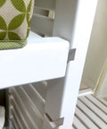 Heavy Duty Solid Wood Closet Storage Rack With Wide Shelves And Hanging Rods Straight Up Kickin Up Your Reach In Space Cut To Fit Any Pantry Or Laundry Closet White close-up of sturdy white shelf and decorative storage bin.