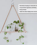 Wooden shelf with glass jars and plant hanging on metal hooks, with a text about organization and indoor display on the right
