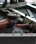 Durable Aluminum Tool Organizer Box With Secure Twist Latches Portable Travel Case Scratch Proof Exterior on a workshop bench.