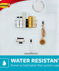 Water-resistant bathroom wall with various holders including a brush, demonstrating durable adhesive mounts for organization.