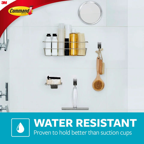 Water-resistant bathroom wall with various holders including a brush, demonstrating durable adhesive mounts for organization.