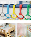 4 Pack Baby Walk Assistant Crib Pull Rings In Red Blue Green Yellow For Infant Toddler Walking Practice Cot Hanging Rings Durable Plastic 7.5 Inch Set Great For Home Use. Four crib pull rings on baby crib rails, 7.5 inch plastic, multicolor