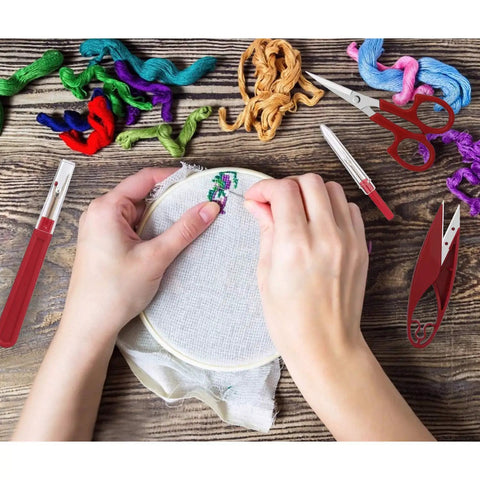 Hands embroidering with threads, showing Sewing Seam Ripper Kit With Two Large And Two Small Rippers, Thread Snips And 5 Inch Scissors.