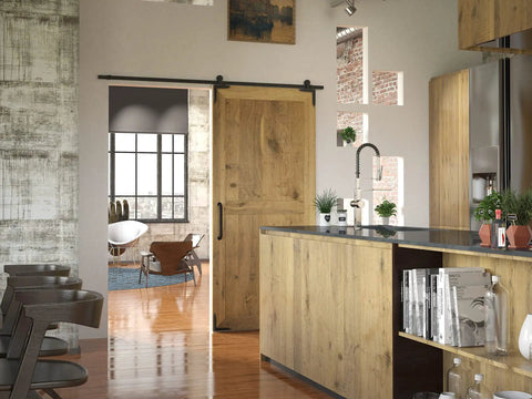 Rustic kitchen interior featuring a sliding barn door and No Sweat Matte Black Forged Iron Corner Brackets For Barn Doors.