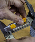 All In One Knife Sharpening Kit That Seriously Handles 6 Stones For Straight And Serrated Blades in use with angle guide