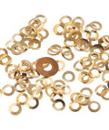 Set Of 100 Brass Hour Wheel Washers For Clock Repair scattered, highlighting DIY friendly brass spacers for hour wheel assembly