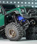 Beefed Up Brass And Aluminum 59mm Long Threaded Oil Shock For TRX4M RC Car Upgrade with CNC Machined Shock Bodies visible on off-road vehicle