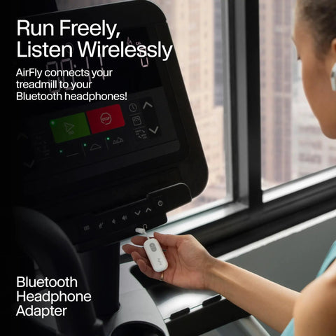Person using Wireless Bluetooth Audio Transmitter For AirPods And Headphones With 20 Plus Hour Battery on treadmill display