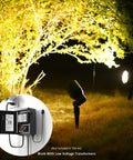 Low Voltage Landscape Spotlight Kit With 20W Halogen Bulbs 12V AC Outdoor Black Lights illuminating garden path