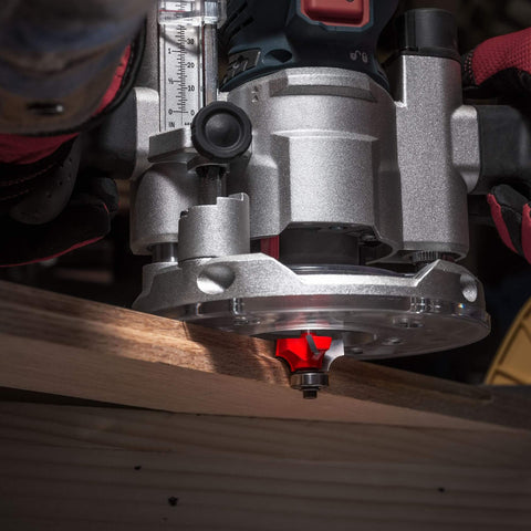 Freud Quadra Cut Radius Rounding Over Bit With Perma Shield Coating in router creating smooth edge on wood plank