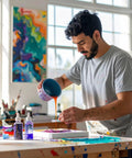 Artist using 5 Quart Plastic Mixing Cups Kit With 48 Pack And 12 Lids For Liquids, Automotive Paint, Epoxy Resin, And Arts And Crafts