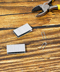 80 Piece Plantation Shutter Repair Kit With Solid Fasteners Sweet Louver Hardware No Sweat Window Blind Tilt Rod Staples laid on wooden surface.