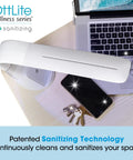 Purify LED Desk Lamp With Wireless Charging, Touch Activated, Flexible Gooseneck illuminating a desk with phone and keys