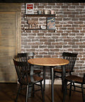 Vintage Brown Brick Peel And Stick Wallpaper on wall behind rustic dining set and shelf
