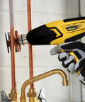 FURNO 700 Digital Heat Gun with 2 Nozzles used for soldering copper pipes, showcasing temperature control and ergonomic design.
