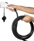 32 Amp Level 2 Electric Vehicle Charging Station With Smart Display And 25 Ft Cable held in hand, showing Nema 14 50 plug.