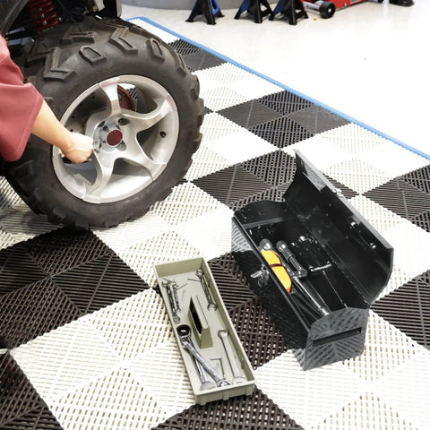 19 Inch Portable Steel Tool Box With Hip Roof Design, open on floor next to car tire in garage, showing removable storage tray.