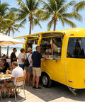 Kickass Commercial Stainless Steel Food Trailer With Integrated Air Conditioning Heavy Duty Mobile Kitchen Rig serving food at beach.