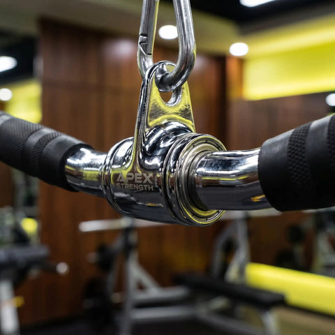 Close-up of Lat Bar Cable Machine Attachment with Full Rotation Rubber Grip, showing shiny steel and carabiner detail in gym setting.