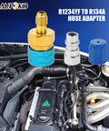 R1234YF To R134A Low Side Quick Coupler For Car AC Charging With R12 To R134A Hose Adapter Fitting over engine bay view.
