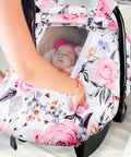 Girls Car Seat Cover Pea Pod Infant Canopy With Dual Windows And Breathable Mesh Lightweight Polyester shown in floral design on a car seat.