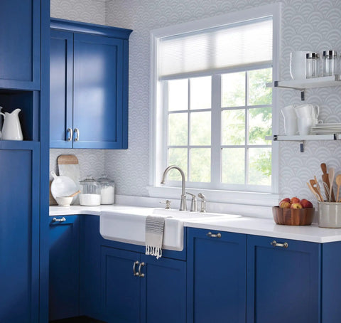 Top Shelf High Arc Kitchen Faucet With Spot Resist Stainless Finish And Smooth One Handle Design To Make Kitchen Chores An Absolute Breeze On Your Counter in a blue kitchen.