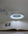 Illuminated Workstation Magnifier With Swing Arm Pro Grade 5 Inch Optical Grade Aspheric Glass Lens 90 LED Lighting over book
