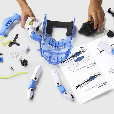 Hands On Wearable Robotic Hand Kit For Kids 87 Piece DIY STEM Project components laid out with instructions visible.