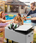 80 Quart Rolling Ice Chest On Wheels With Bottle Opener next to people enjoying drinks at a poolside party