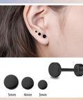 Straight Up Titanium Screw Back Stud Earrings Zero Drama For Sensitive Skin Medical Grade F136 Nickel Free Flatback Dot Design Secure Locking Posts For Daily Wear shown on ear with 3 black dots of different sizes.