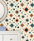Retro Starburst Peel And Stick Wallpaper Roll With Heavy Duty Self Adhesive Backing For Instant Accent Wall Makeovers That Hit Different With Bold Geometric Patterns And Offer Zero Fuss Transformation Across Any Room. Close-up of colorful starburst pattern on wallpaper with mirror and drawer.