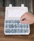 Hand sorting bolts from the 2250 Piece Bolts And Nuts Assortment Kit Including Metric And Imperial Machine Screws Plus Flat Washers In Alloy Steel.